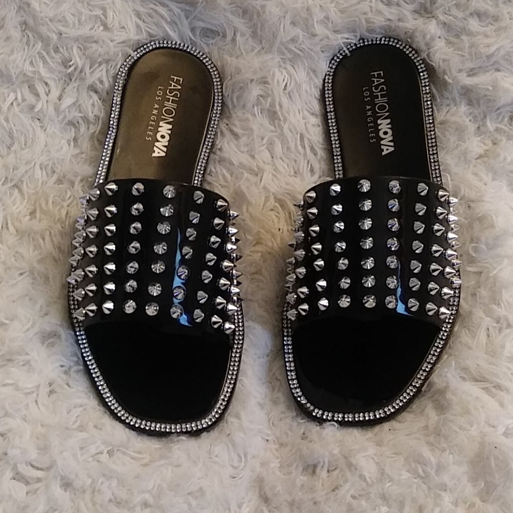 Black rhinestone spikes on the top size eight shoe